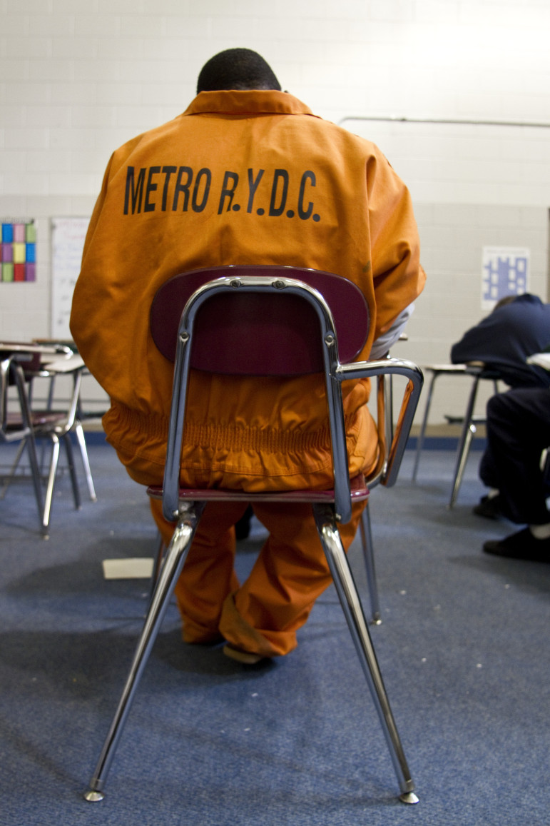 Students considered a high security risk must wear bright orange jumpsuits.