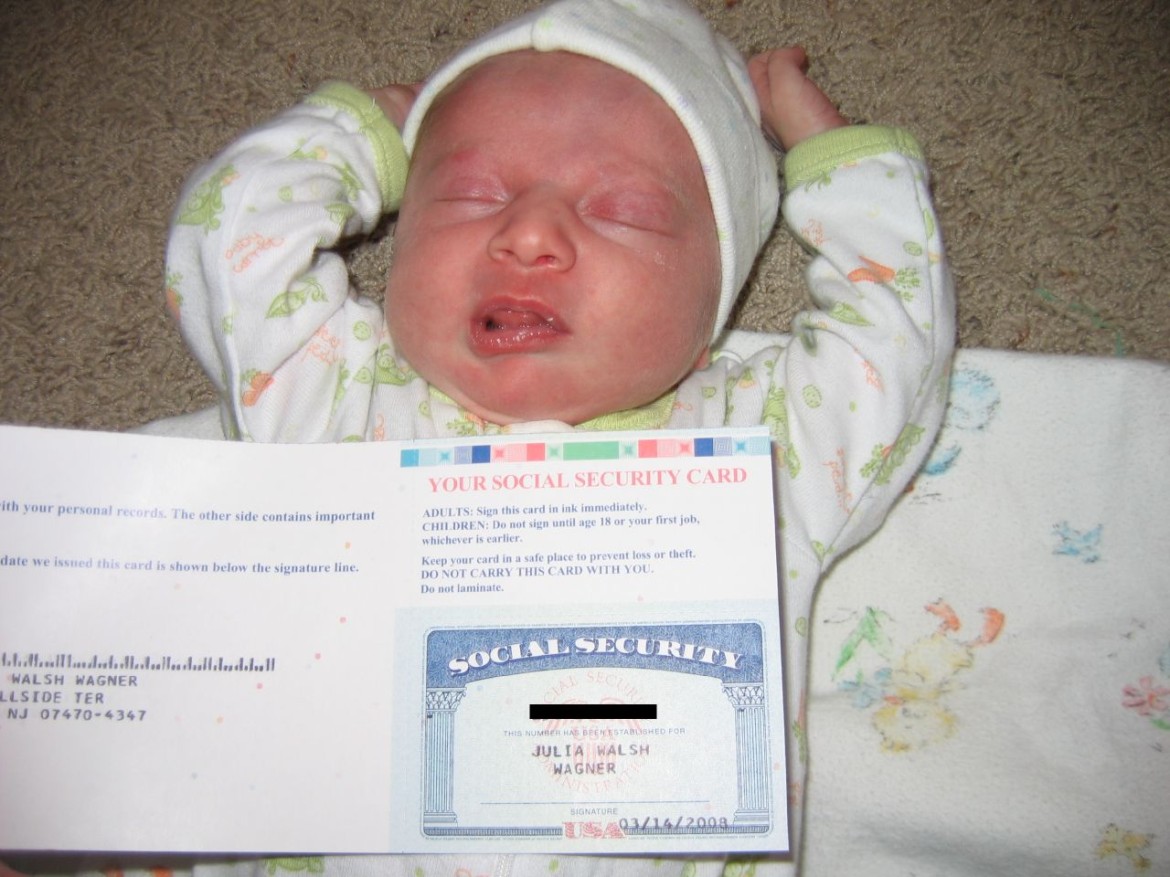 Two-week old Julia Walsh receives her social security card. Photo credit: Kurt Wagner/Flickr