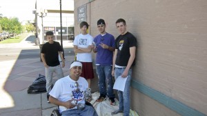 Javier Flores working with Access Gallery youth on a public mural project in Denver, Colo.