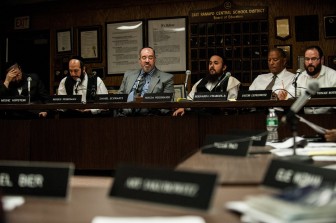 The predominantly Hasidic school board at the budget meeting. 