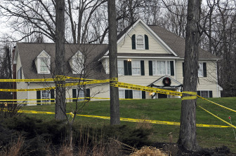 Police tape surrounds the area near the home of Nancy Lanza, the mother of Adam Lanza, who fatally shot twenty children and six adult staff members in a mass murder at Sandy Hook Elementary School in December 2012. 