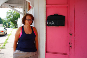 Celia Peoples stands outside her home in Harrisburg, where she lives with her mother, Hammons. Of Hammons' $700 monthly Social Security check, $400 goes to rent, leaving barely enough for other expenses and nothing at all for Celia to travel to Kewanee to see Jaime. 