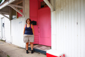Celia stands outside her home in Harrisburg, where she lives with her mother, Kathy Hammons. Of Hammons' $700 monthly Social Security check, $400 goes to rent, leaving barely enough for other expenses and nothing at all for Celia to travel to Kewanee to see Jaime. 