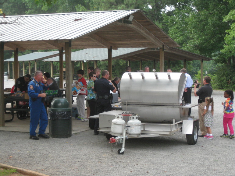 Community members barbecue at Swift-Cantrell Park for National Night Out in Kennesaw, Ga
