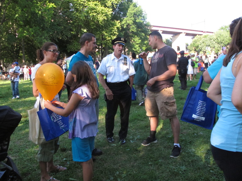  Community members chatting at a National Night Out event at Astoria Park in Queens, N.Y.