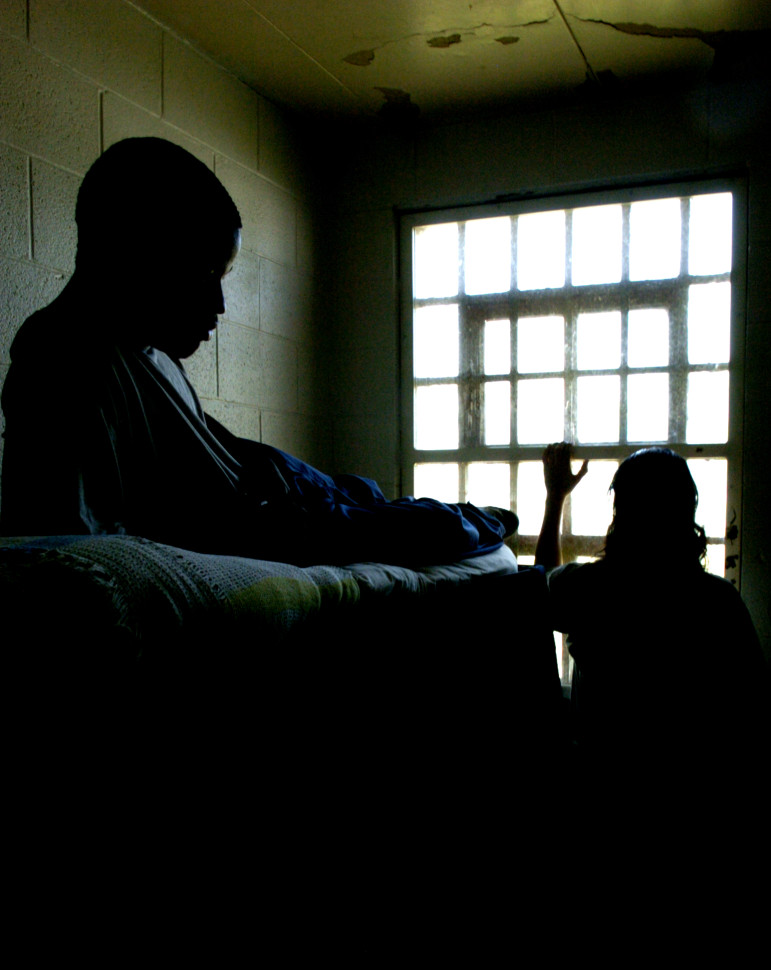 Youths inside their confinement rooms at the Illinois Department of Juvenile Justice Center on Tuesday, August 1, 2006, in Joliet, Ill. 