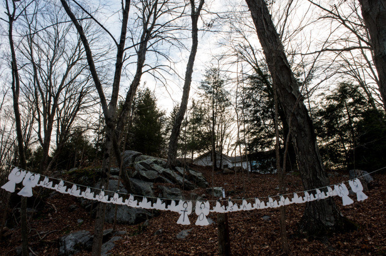 NEWTOWN, Conn., -- Nearly one year after the massacre at Sandy Hook Elementary School, the town has struggled to reclaim its identity as a quaint New England town. A "Welcome to Sandy Hook" sign of angels hung along highway 34.