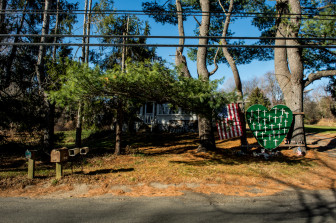 NEWTOWN, Conn., -- Nearly one year after the massacre at Sandy Hook Elementary School, the town has struggled to reclaim its identity as a quaint New England town. A memorial set up a near the shooting filled the yard of a home.  