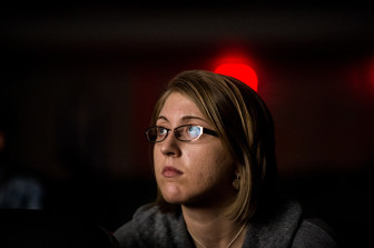 Leah Nelson watches "The Anonymous People at Goodwin College Saturday morning."
