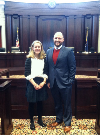 Matilyn Sarori, who wrote the 23-page brief for the Michigan Supreme Court, stands in a courtroom at the Michigan Hall of Justice with Patrick Jaicomo, one of the two attorneys who submitted the brief.