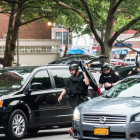 Members of the NYPD raid the Manhattanville Houses and the Grant Houses in West Harlem early on the morning of June 4, 2014. A total of 40 suspects were arrested as part of a massive 145-count indictment of 103 people in a range of crimes, including murder, 19 shootings, gang assaults, beatings and conspiracy.