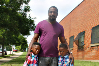 Danyel Edney — a 39-year-old Baltimore man shown with his 6-year-old sons, Dakari, left, and Damani, right — said he favors the city’s newly approved youth curfew. Edney said the curfew will help keep children from becoming victims or perpetrators of violence.