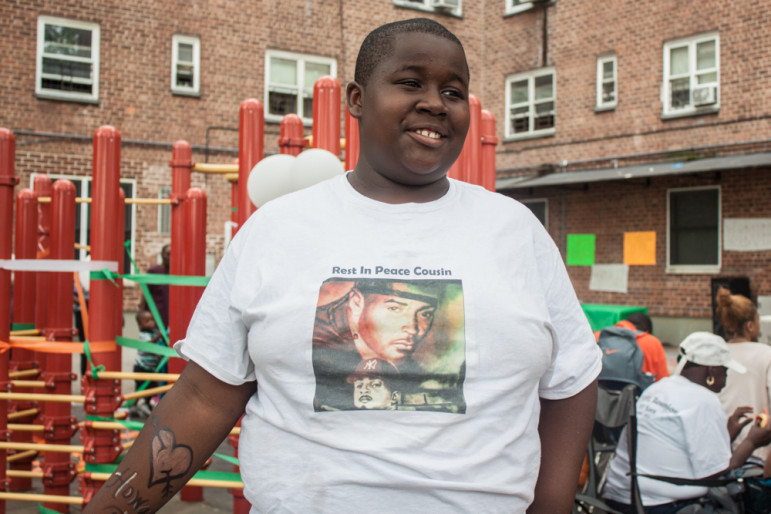Jahmel Leath, 13, wears the T-shirt of his murdered cousin, Stack Bundles at the "Children's Day of Peace" event at Redfern Houses in Far Rockaway.