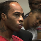 Kenneth Young at his resentencing hearing, with his mother and niece in the background.