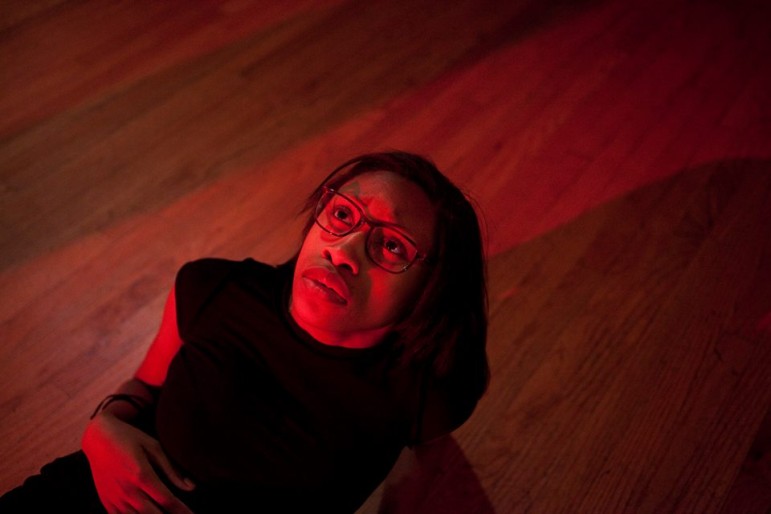 Kayla Brathwaite in "Bar Code: A performative analysis of the school to prison pipeline," a production by Truthworker Theatre Company.