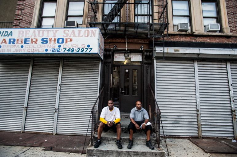 Derrick Haynes (left) and Taylonn Murphy sit together in West Harlem in this August 2013 photo.