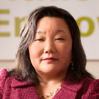 Jeannette Pai-Espinosa (headshot), woman with necklace, maroon jacket