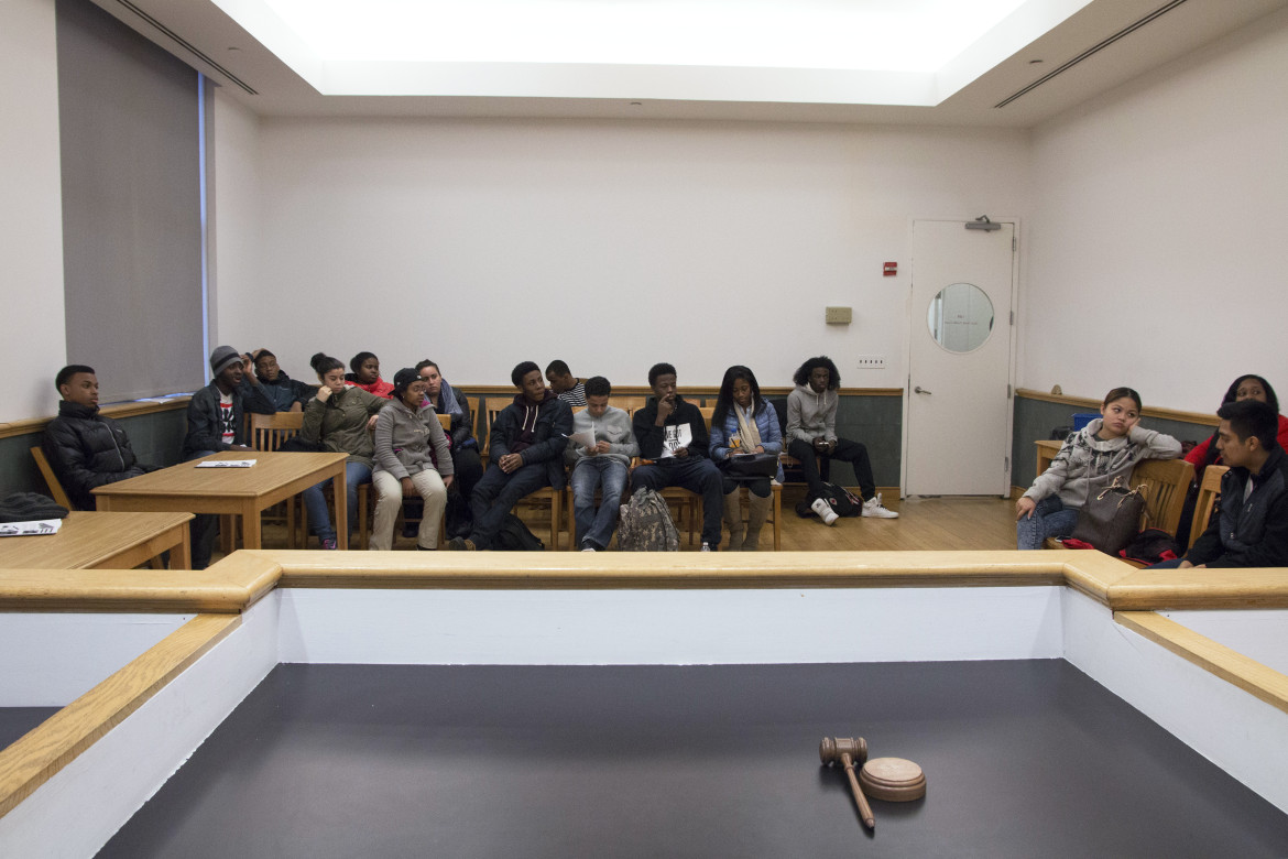 raise the age: Young people sit in small courtroom.