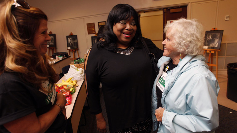 Marietta Jaeger hugging Marilyn Stark-Grant, mother of a death row prisoner in Texas, with Terri Steinberg (at left), whose son was on Virginia's death row for more than a decade. 