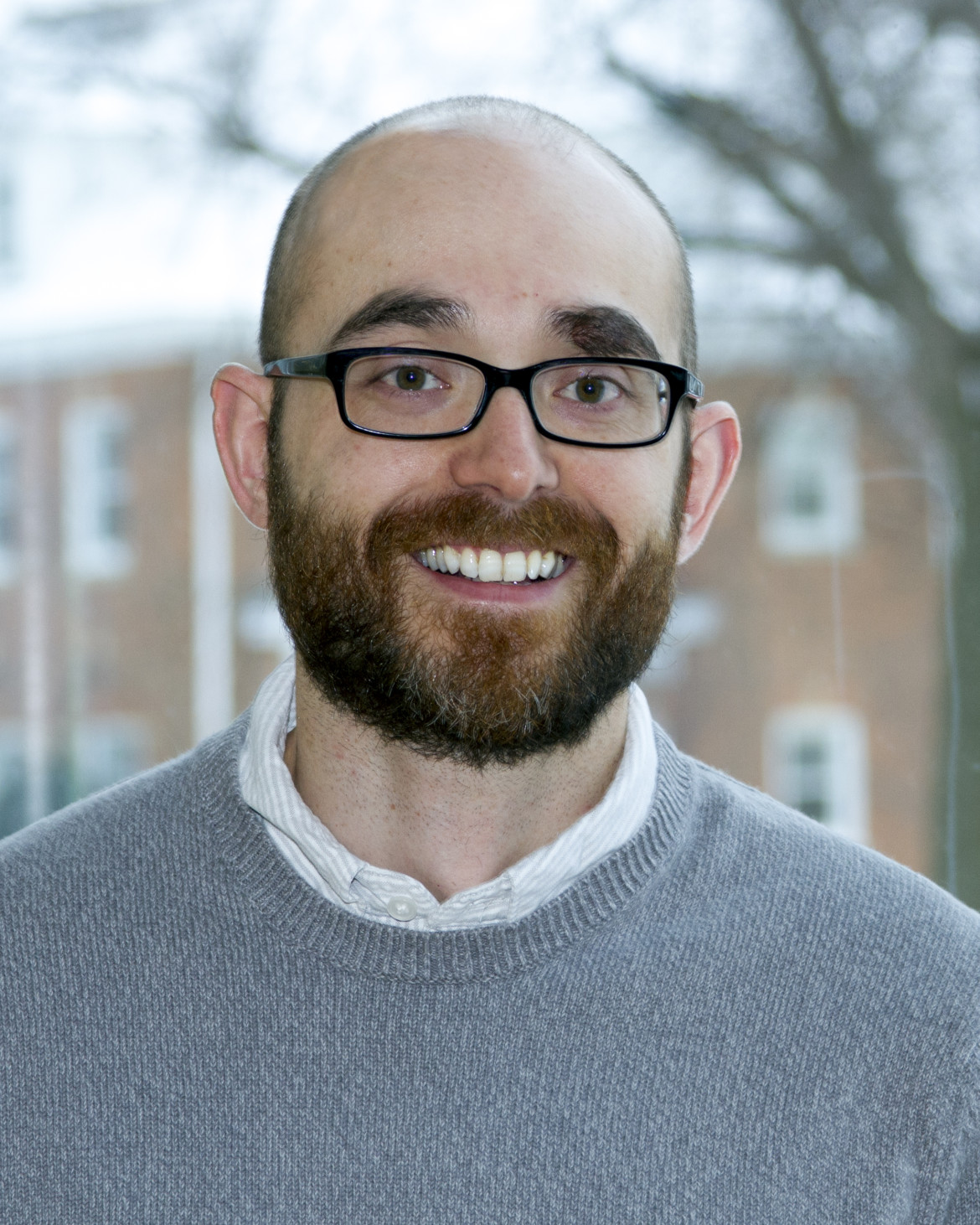 risk assessment: Fredrick Butcher (headshot), research assistant professor at Case Western Reserve University, smiling man with dark beard, mustache, glasses wearing blue sweater over shirt.