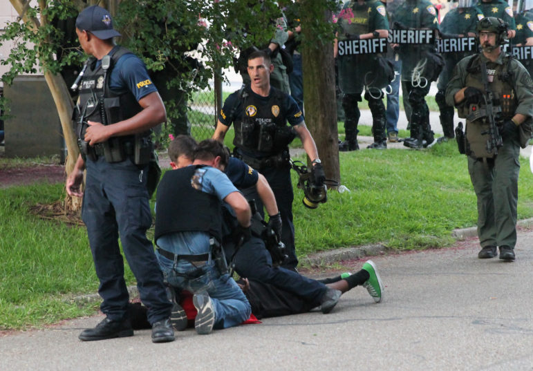Officers make an arrest during a protest in Baton Rouge on July 10, 2016. Protesters are calling for justice for Alton Sterling, who was killed by Baton Rouge police on July 4, 2016.