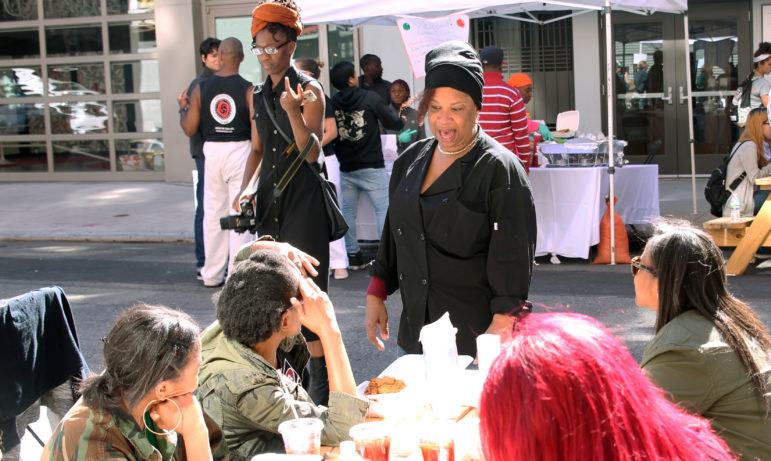 Sharon Richardson talks with young people at a block party for the Women’s Building in New York on Sunday. 