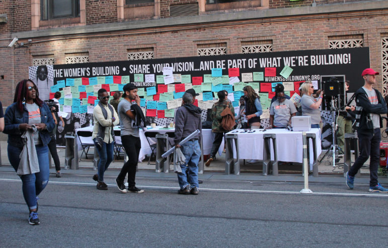 Neighborhood residents’ visions for the Women’s Building are posted on a wall at a block party held in New York on Sunday. 