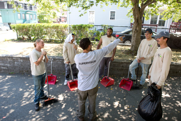 Roca participants and their crew supervisor clean the streets of Chelsea, Massachusetts, as part of Roca’s contract with the city. The young men are in a transitional employment program, where they gain real wages for real work while learning critical job skills. 