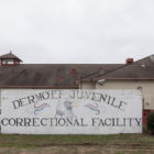 Youths went cold, dirty while held at Dermott Juvenile Correctional Facility, sign in front of building.
