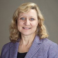 Lisa Thurau (headshot), executive director of Strategies for Youth; smiling blond woman in lavender jacket, black top.