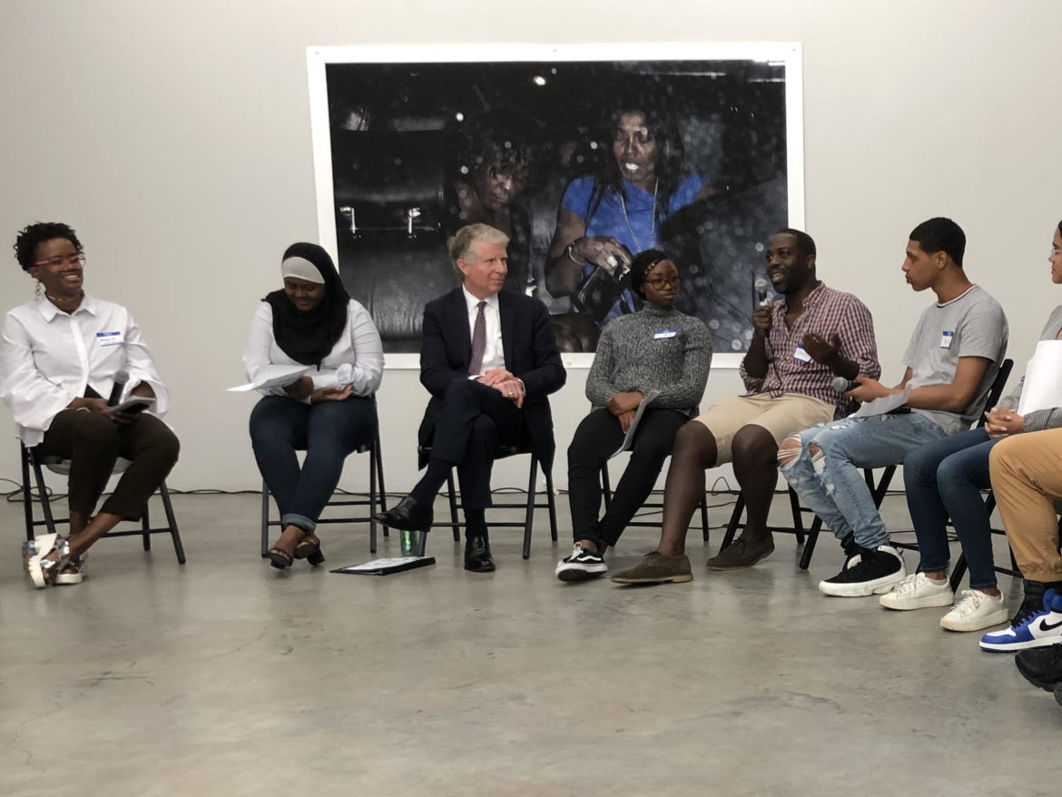 Artists and alumni from Project Reset met Wednesday to talk with District Attorney Cyrus Vance about the program’s future. Among them were artist Marquita Flowers (far left), Vance (third from left) and artist Derek Fordjour (holding microphone).