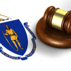 Massachusetts: Massachusetts US state law, code, legal system and justice concept with a 3d render of a gavel on the Massachusetts flag on background.