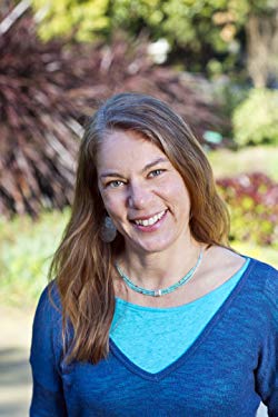 California: Dashka Slater (headshot), author, smiling woman in two-toned blue top.