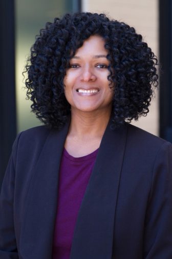 ck girls: Cherice Hopkins (headshot), staff attorney at Rights4Girls, smiling woman with curly hair in dark jacket, purple top.