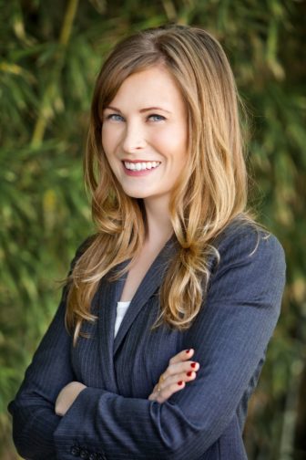 Education: Hailly T.N. Korman (headshot), principal at Bellwether Education Partners, smiling woman with long blond hair, dark blue jacket.