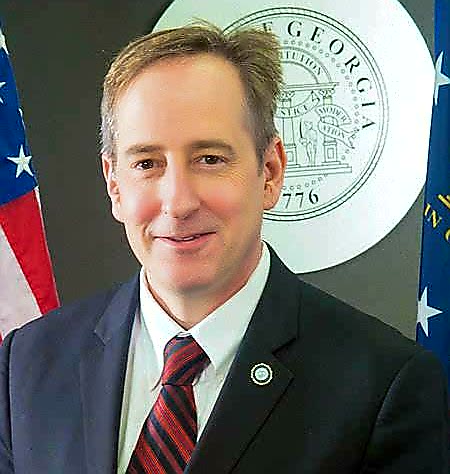 community-based alternatives: Joe Vignati (headshot), assistant commissioner of the Georgia Department of Juvenile Justice, smiling man with short brown hair, blue jacket, white shirt, patterned tie