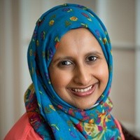fees and fines: Nadia Mozaffar (headshot), Juvenile Law Center staff attorney, smiling woman in blue print headscarf, orange top