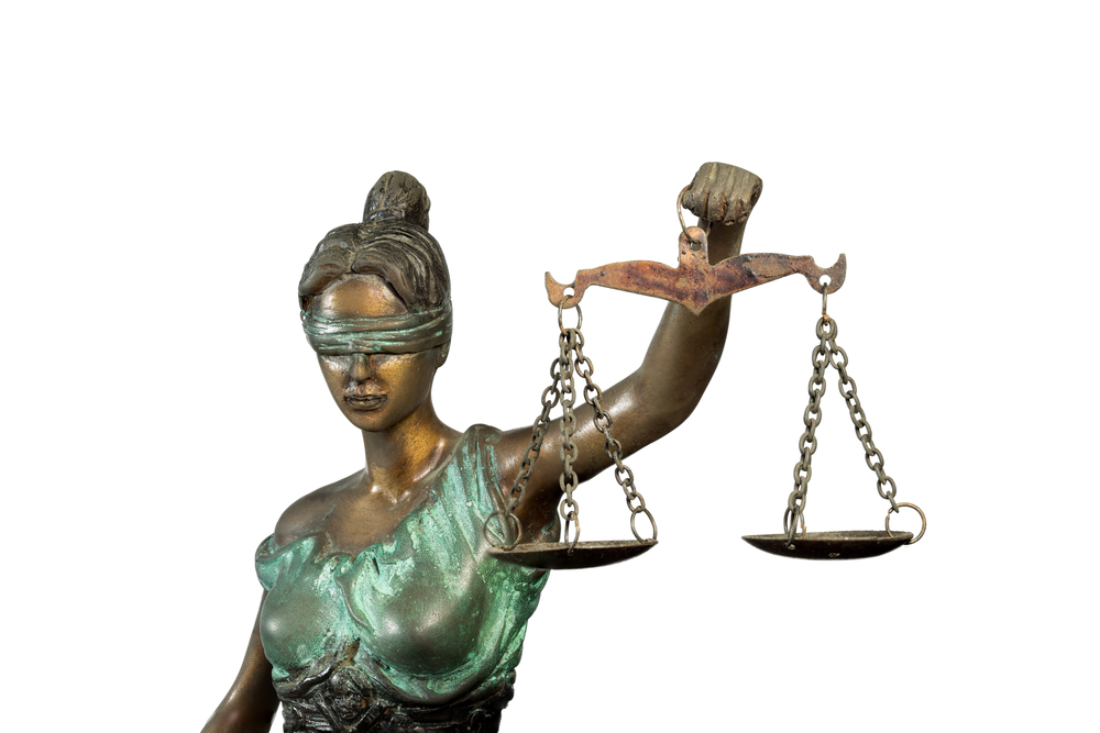 judges: Statue of blindfolded justice isolated on white background