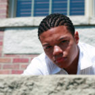 diversion: Close-up of scowling African-American teen boy with cornrows