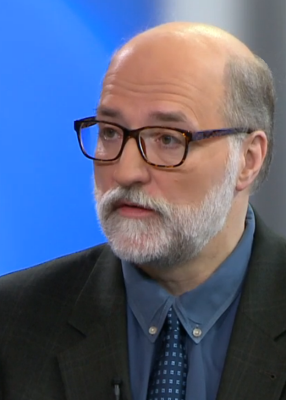 OJJDP: Jeffrey Butts (headshot), man with glasses, gray beard and mustache