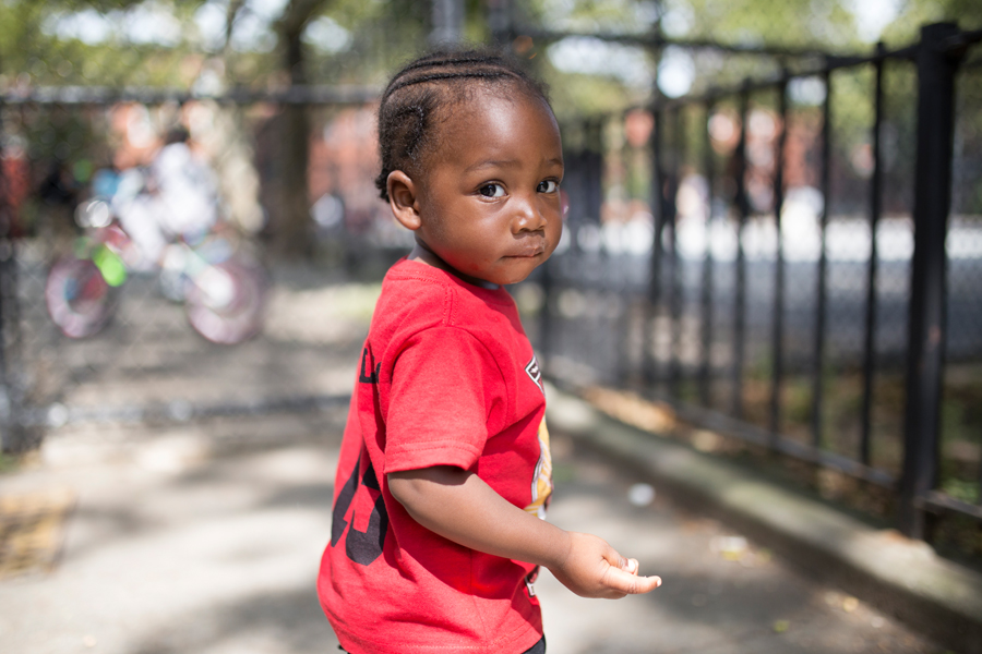 Toddler in red T-shirt.