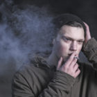 homeless youth: smoking sad guy