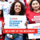 Young people hold up signs saying students demand action.