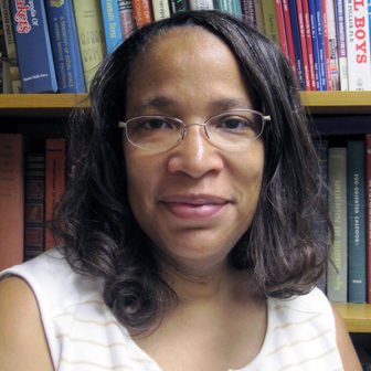 diversion: Angela Bell (headshot), coordinator of Montgomery County (Penn.) Disproportionate Minority Contact project, woman with shoulder-length black hair, glasses, white and beige sleeveless top in front of bookcase