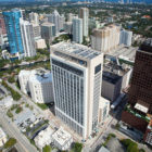 Broward County: Cityscape with tall white building in center.