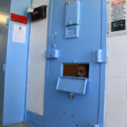 room confinement: The door to a cell.