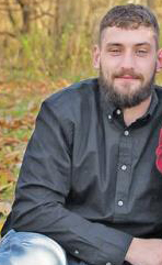 fentanyl: Sitting man with beard, mustache wearing dark shirt
