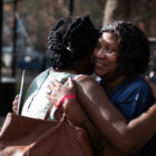 police shooting: 2 women hug outdoors