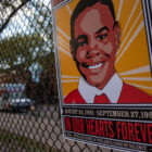 police shooting: Poster of boy with dates and “In Our Hearts Forever” and “NYPD, Culture of Violence, Code of Silence”