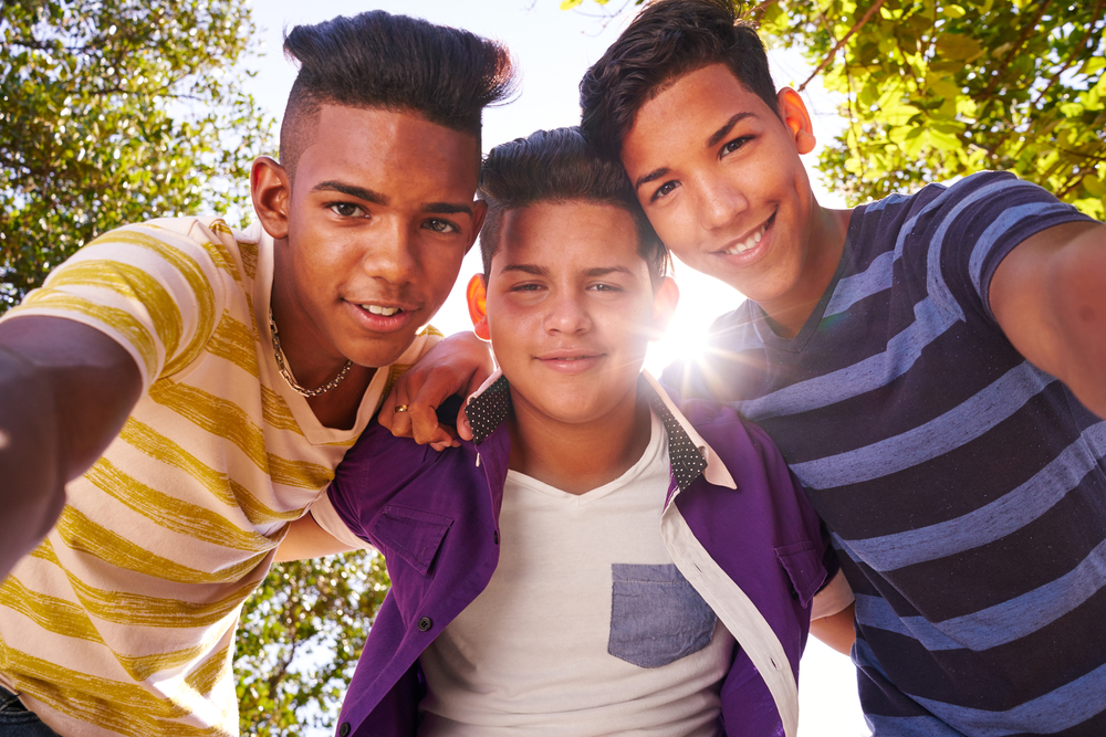 California: Concept of racism and integration. Portrait of happy boys smiling